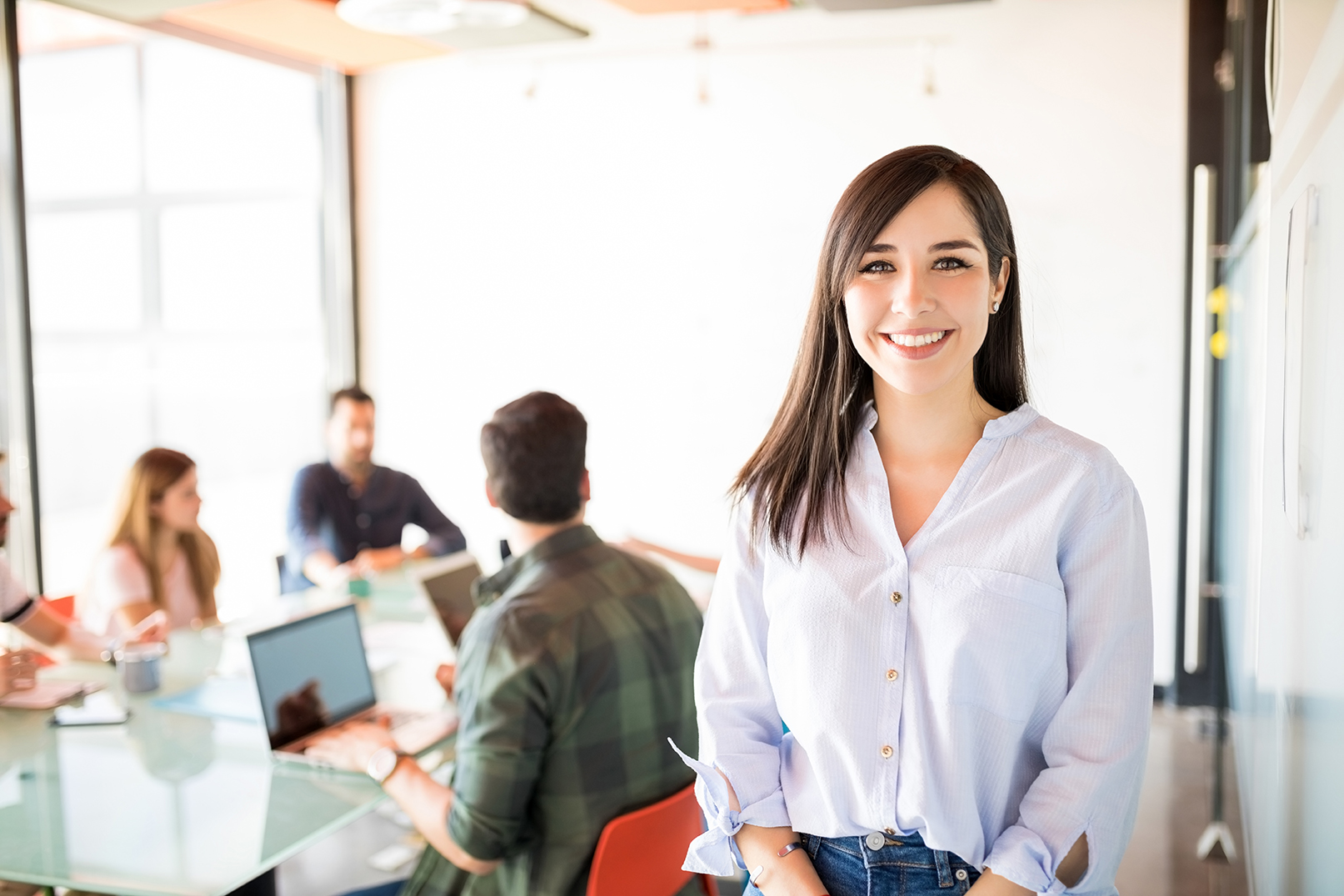 Woman standing during a group meeting