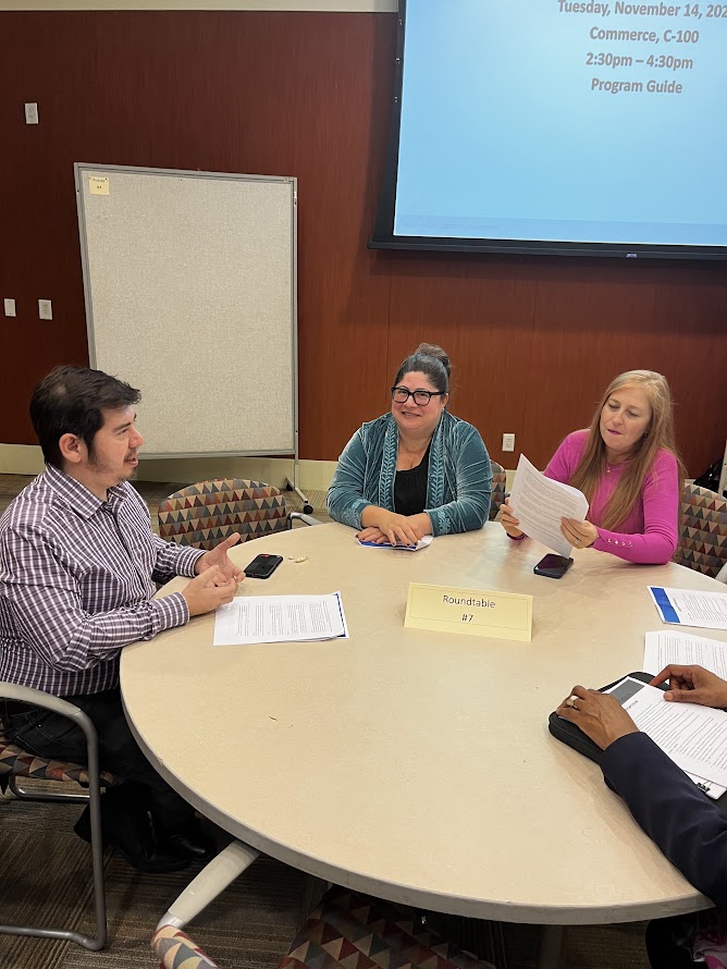 Faculty members having a discussion