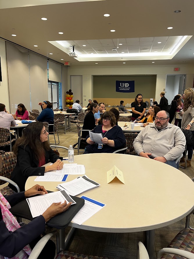 Faculty members having a discussion