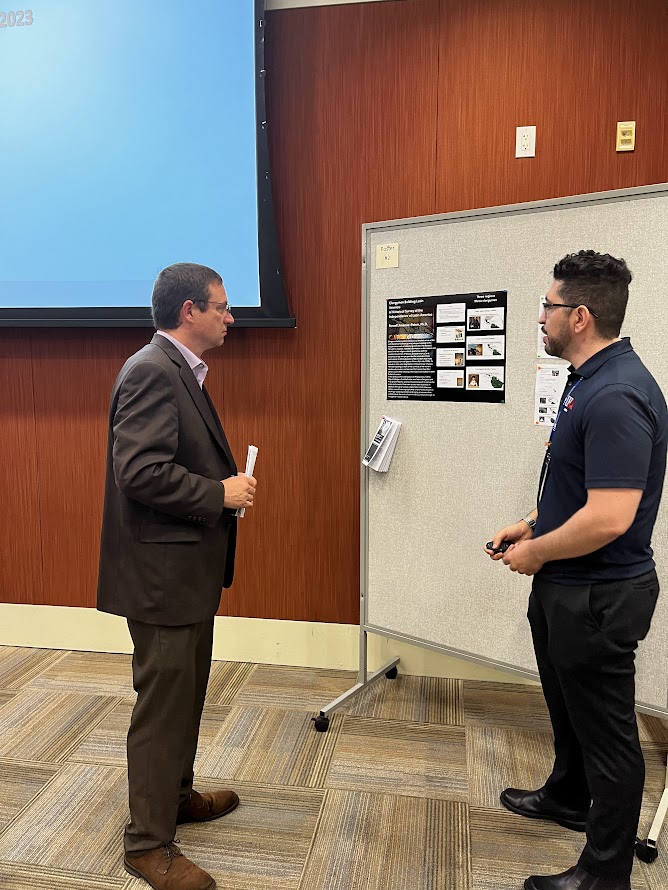 Dean Davis looking at faculty research