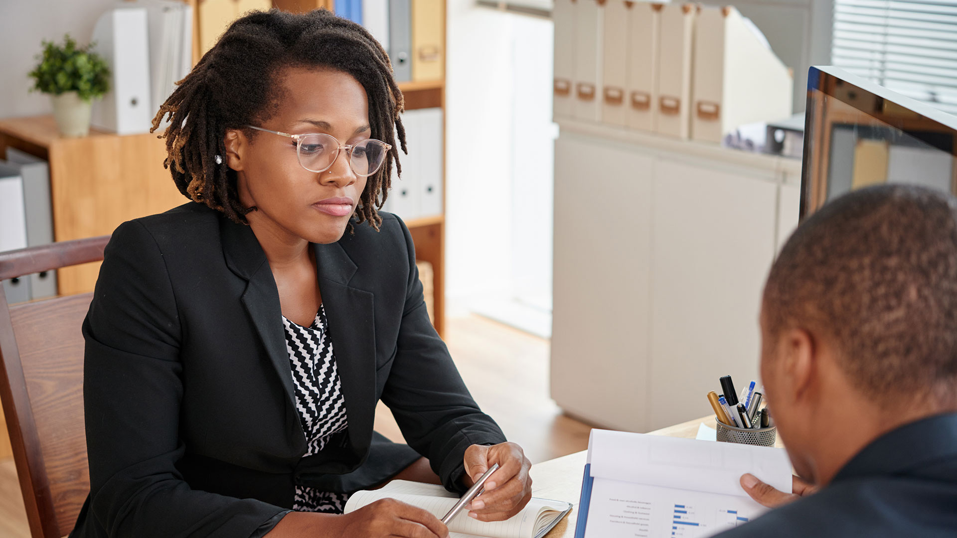 woman interviewing a man for a job