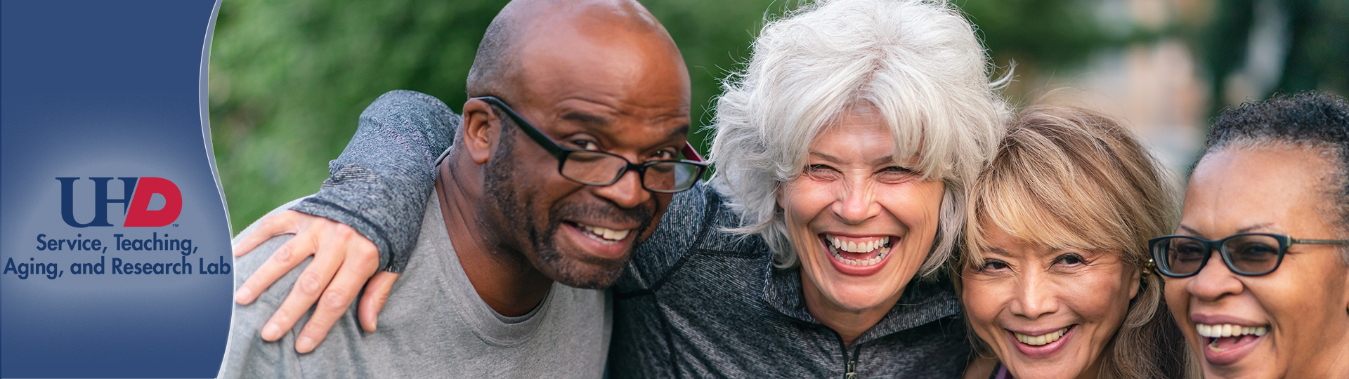 Older Adults hugging and smiling.