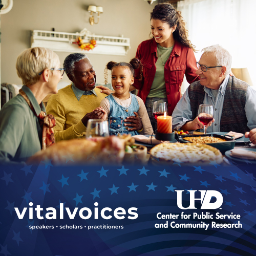 Families and Politics - elderly family and friends smiling together at the dinner table.
