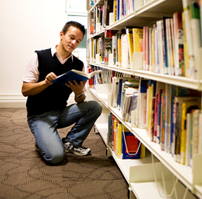 image of student picking out a book