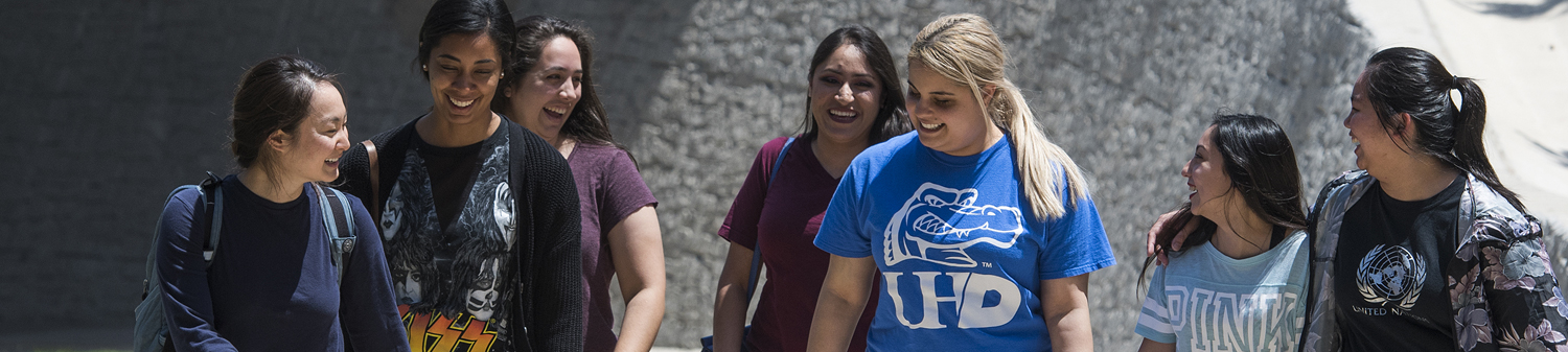 Group of UHD student walking on campus