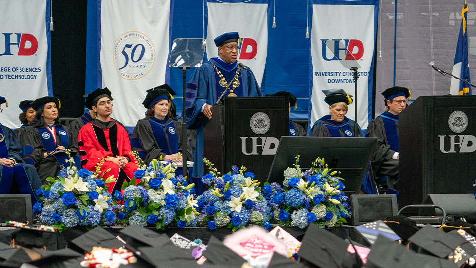 President Blanchard at podium during commencement