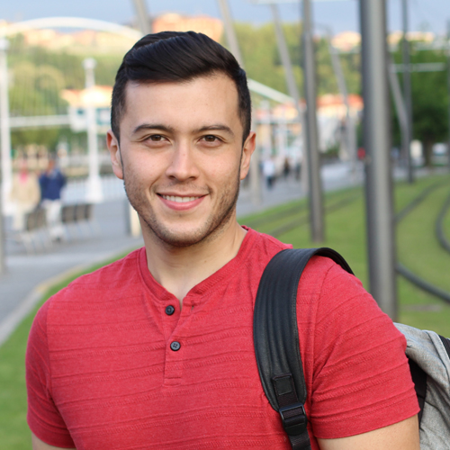 male student smiling at the camera