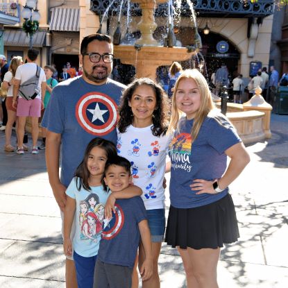 Monica Comeaux and her family post for a group photo at Disney World.