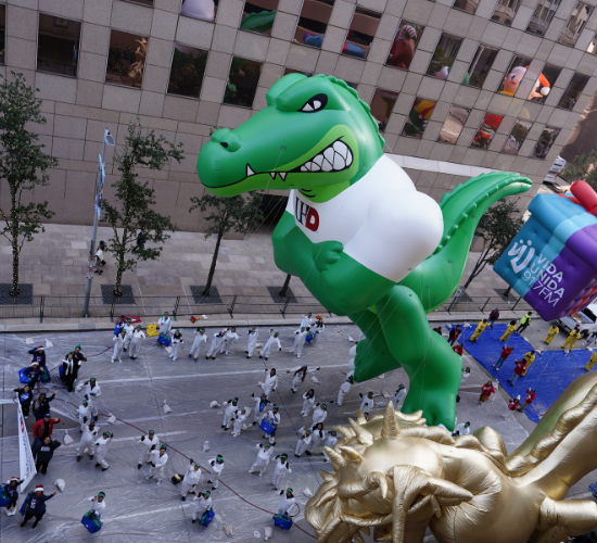 overhead perspective of edugator balloon and parade volunteers from the university of houston downtown