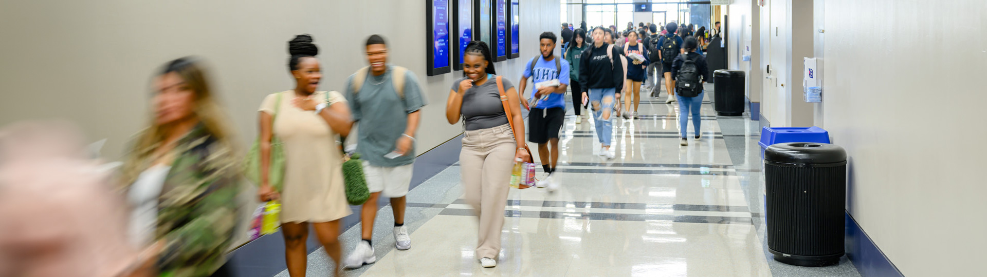 Students walking in the Academic Building Hallway