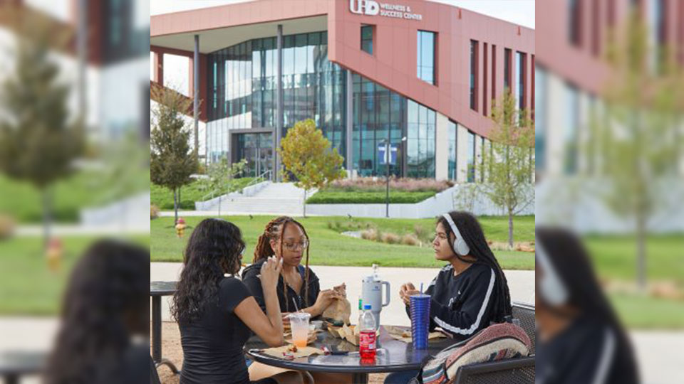 Students with the Wellness & Success Center in the background