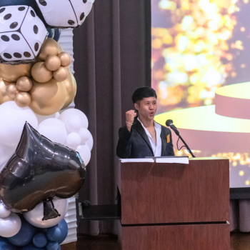 UHD student speaks at a podium 