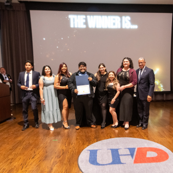 A student group stands aside UHD President Loren J. Blanchard 
